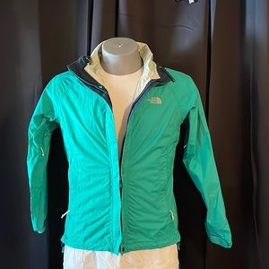 The north face women’s rain jacket teal in color size small petite